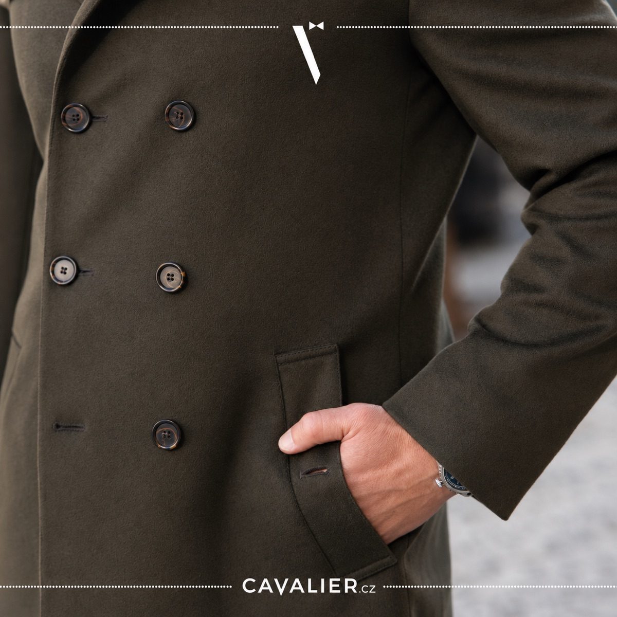 Close-up of an olive double-breasted made-to-measure coat with prominent buttons and pocket