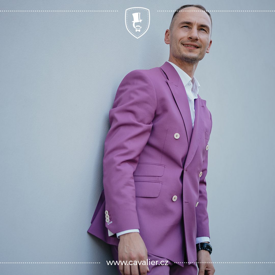 Man wearing a purple Cavalier double-breasted jacket with pale buttons and peaked lapels.