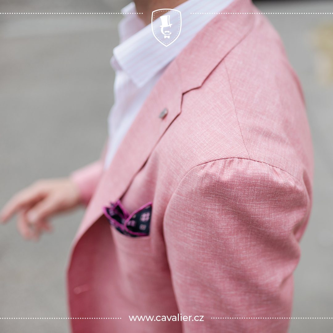 Detail of a pink Cavalier linen jacket with a pocket square for a summer wedding