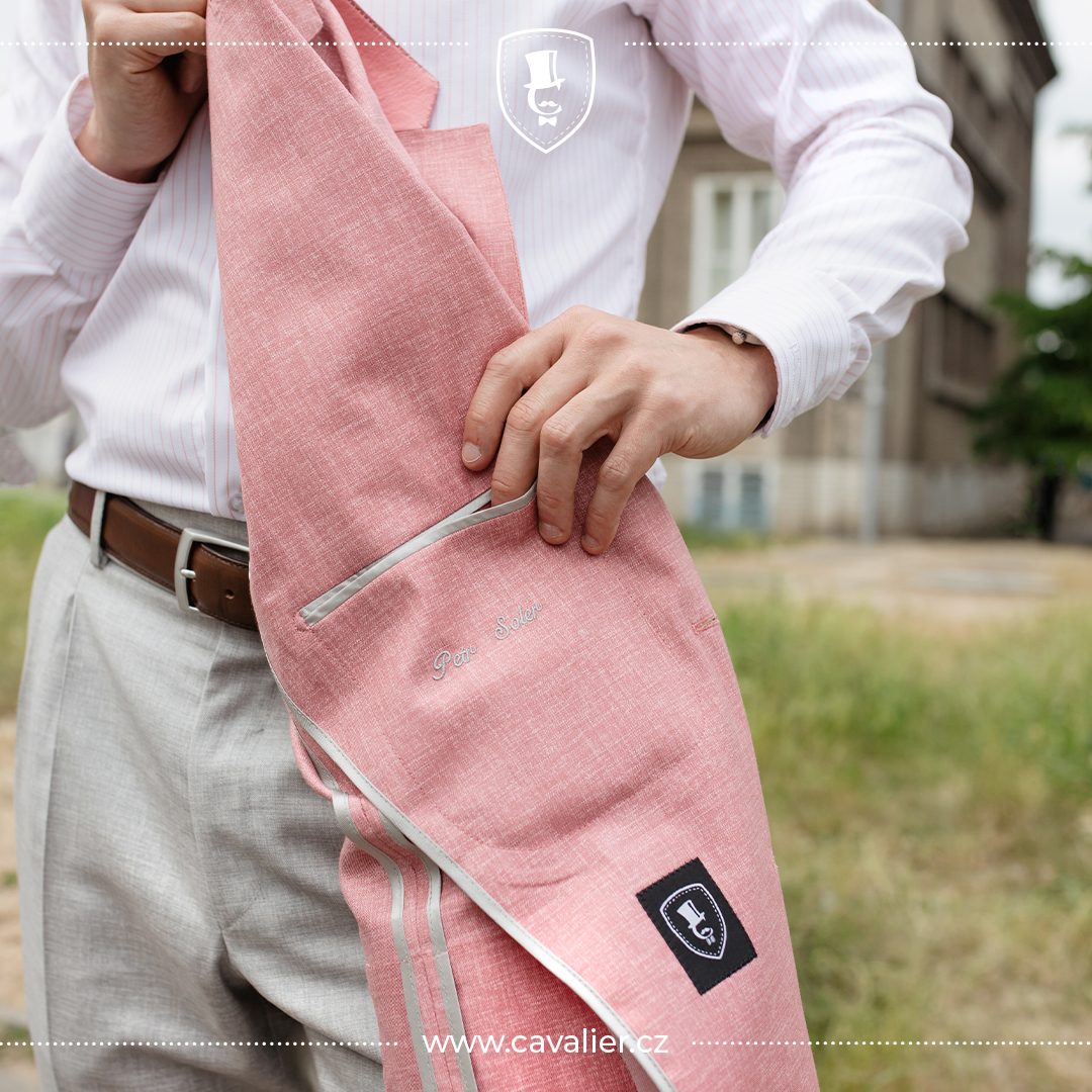 Inside detail of an unlined pink Cavalier linen jacket with an embroidered monogram