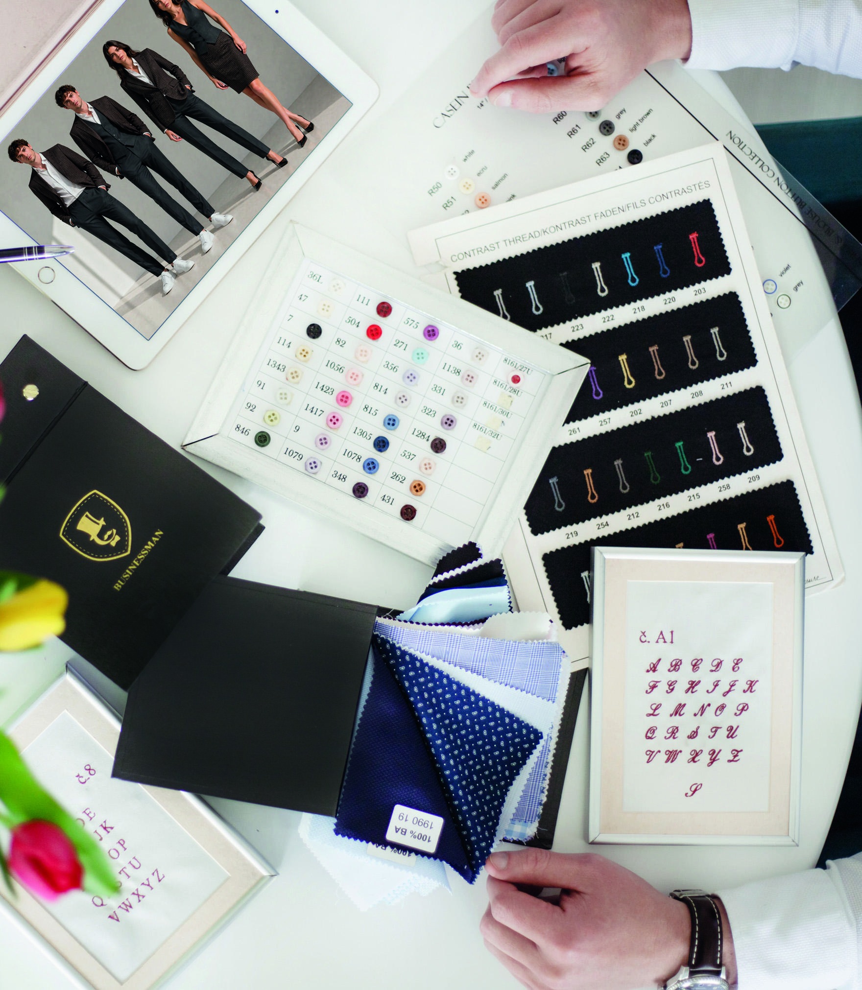 Fabric, button, embroidery and colour samples for corporate clothing