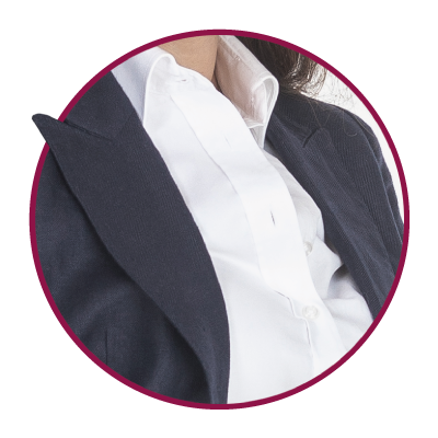 Dark women's jacket over a white blouse.